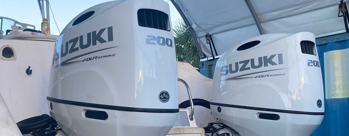 Twin Suzuki 200HP White on the Back of a Catamaran